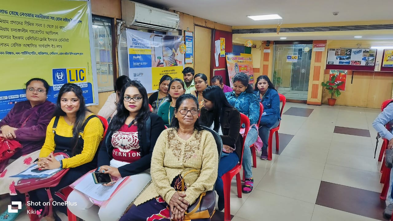 car interior from central back seat position showing driver and blurred view through windscreen of a busy road at night