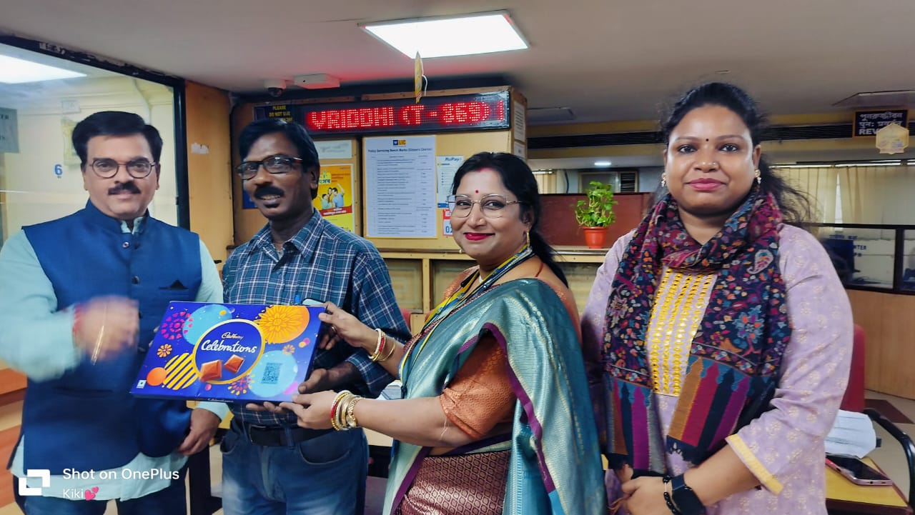 people holding umbrellas on a busy street at night lit by street lights and illuminated signs in Tokyo, Japan